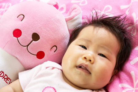 Portrait of a sian cute Infant baby girl (baby are three months)の写真素材