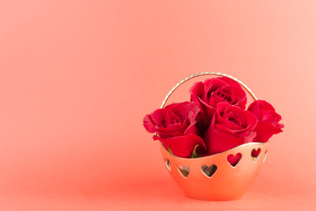 Red rose in gold basket, Valentines Dayの写真素材