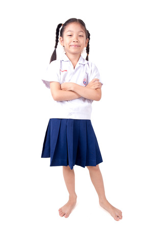 Happy Asian girl wearing school uniform on white background.の写真素材