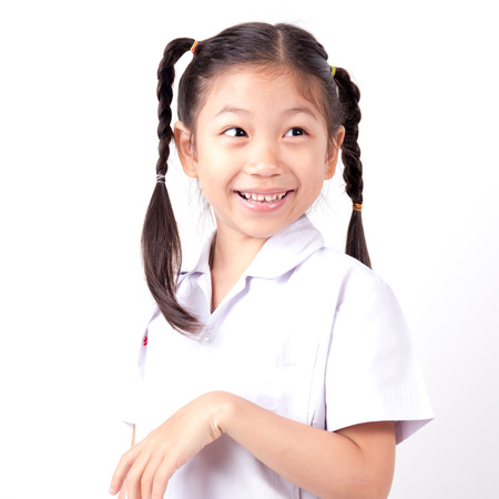 Happy Asian girl wearing school uniform on white background.の写真素材