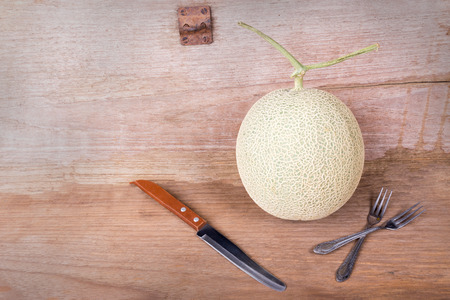 cantaloupe melon on the wooden tableの写真素材