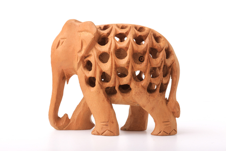 Wooden handmade statuette of elephant a white backgroundの写真素材