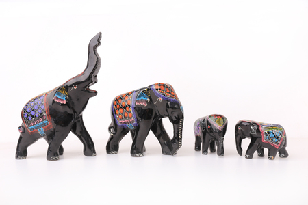 Handemade wooden elephant family  statuette Matte black draw pattern asianの写真素材
