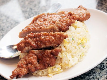 fried rice with deep fried pork の写真素材