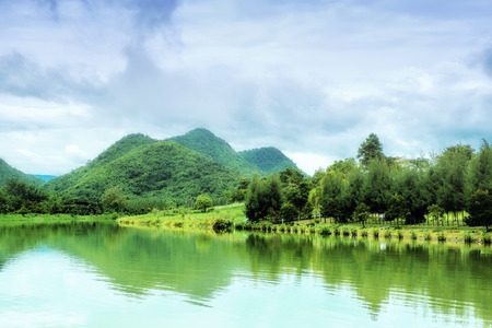 Lake and mountains in Ratchaburi, Thailand.の写真素材