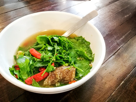 Vegetable soup with spicy fried fish.の写真素材