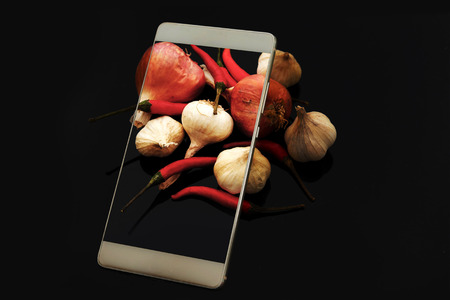 Chili, garlic, shallots With mobile technologyの写真素材