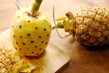 Pineapple on wooden boardの写真素材