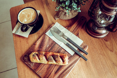 Roll sausage with coffee for breakfast.の写真素材