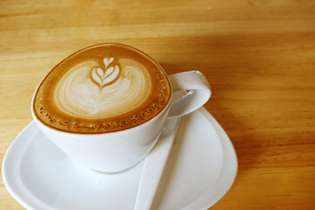 Hot coffee on wooden table                               の写真素材