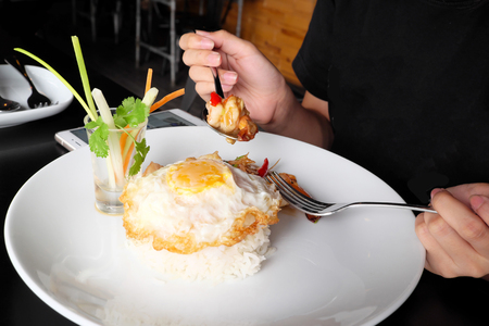 Shrimp fried with rice, garlic, chili and fried egg.の写真素材