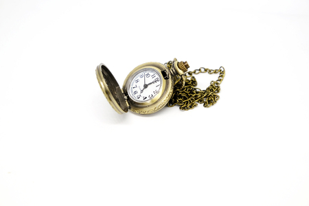 An ancient pocket watch on a white background.の写真素材