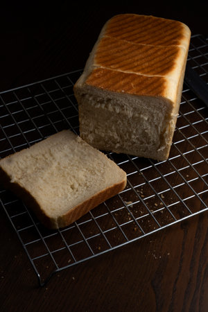 bread on a sieve on a wooden table