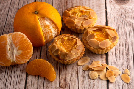 Orange almond pie on wooden tableの写真素材