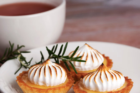 Lemon Tart Meringue with your favorite cup of teaの写真素材
