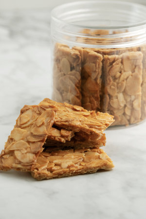 Almond bar cookies slabs on marble table topの写真素材