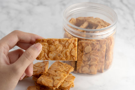 Almond bar cookies slabs on marble table topの写真素材
