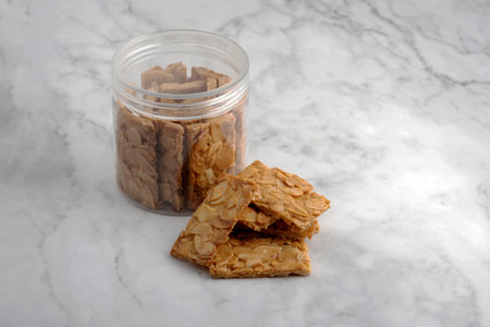 Almond bar cookies slabs on marble table topの写真素材