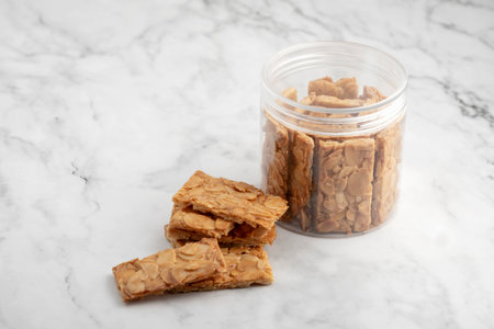 Almond bar cookies slabs on marble table topの写真素材