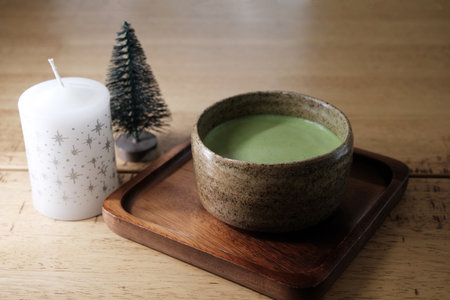 Hot matcha green tea on wooden tableの写真素材