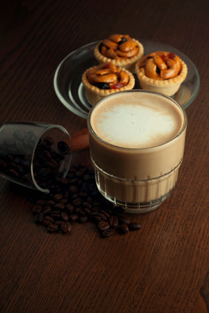 Hot coffee and coffee beans and grain tartsの写真素材