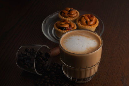 Hot coffee and coffee beans and grain tartsの写真素材