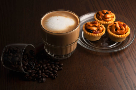 Hot coffee and coffee beans and grain tartsの写真素材