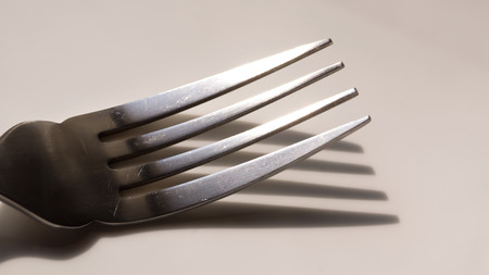 Fork and spoon isolated on white backgroundの写真素材