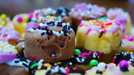 handmade Colorful and tasty mini donuts on white backgroundの写真素材