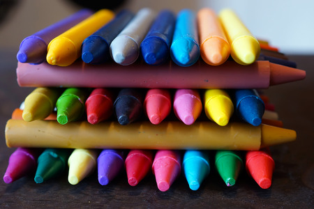colorful Oil pastel crayons on a wooden  black tableの写真素材
