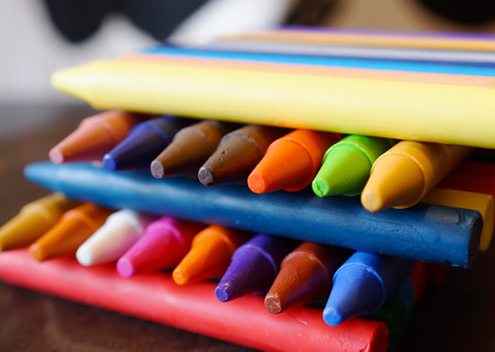 colorful Oil pastel crayons on a wooden  black tableの写真素材
