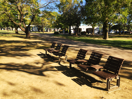 Wooden bench in a public park in japanの写真素材