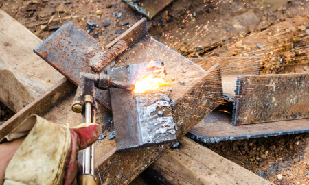 photo of worker doing gas cutting on steelの写真素材