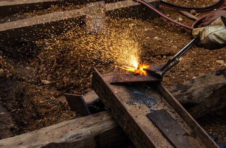 photo of worker doing gas cutting on steelの写真素材