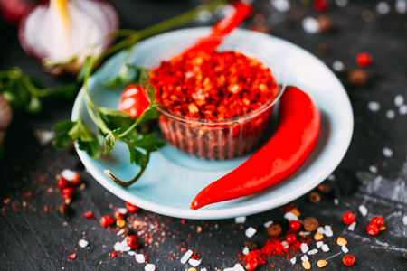 Hot red Chili sauce on dark background