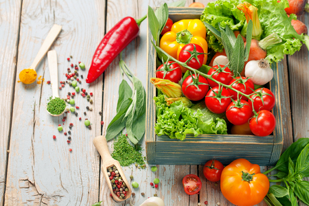 Summer Vegetables set for cooking. Fresh farm vegetables and herbs on rustic background. Bio Organic food. Food background with copy space. Homemade Healthy Cooking concept. Vegetarian eating.の写真素材