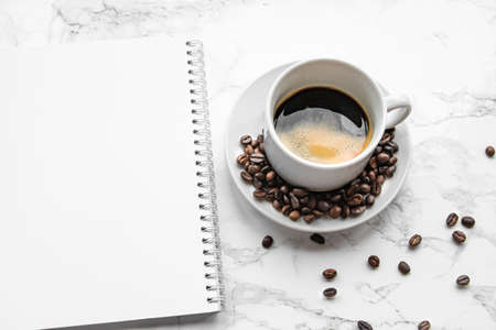 Espresso coffee and notepad with blank page.の写真素材