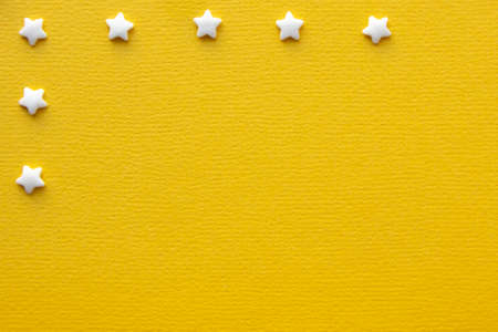 Decorations for pastry on yellow background. Cake decoratingの写真素材