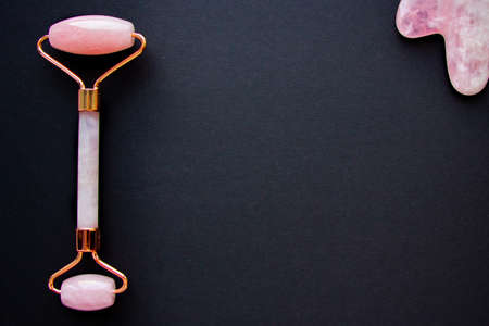 Pink gouache scraper and face roller blackの写真素材