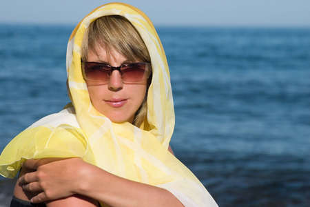 The stylish Woman on a background of the seaの写真素材