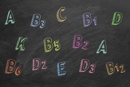 Hand drawing vitamins names on blackboardの写真素材