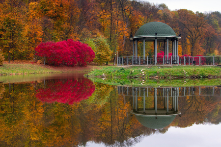 Evening in the autumn city park.
Trees are reflected in the pond. Ukraine, Kyiv. "Feofania" park.の写真素材