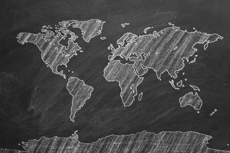 World map hand drawn chalk. Sketch on a blackboard.の写真素材