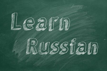 Hand drawing Learn Russian on green chalkboard