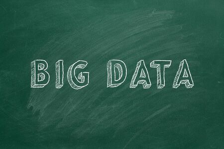 Hand drawing text BIG DATA on green chalkboard.