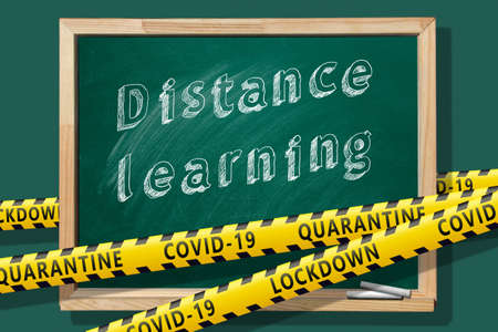 Lettering "Distance learning" on green chalkboard. Covid-19 concept.の写真素材