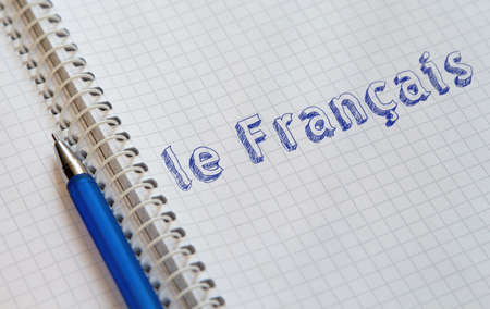 Hand drawing French on sheet of notebookの写真素材