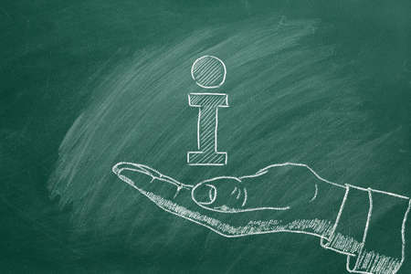 Human hand and info icon drawn in chalk on a blackboard. First-hand information, direct information,...