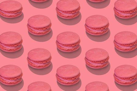 Beautiful composition from large group of pink french macarons on pink background. Flat lay, top view. isometric view.の写真素材