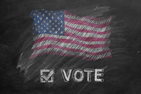 Handwritten word VOTE with American flag on chalkboard. Vote in American election. American...